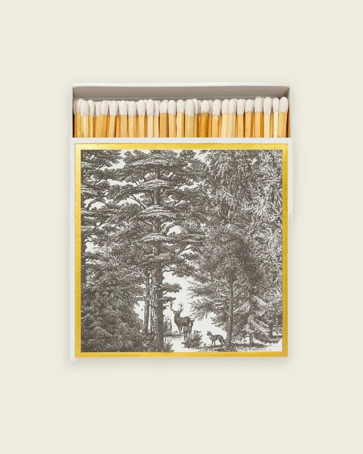 Archivist Enchanted Forest matchbox, letterpress woodland scene with gold foil, open to show the matches